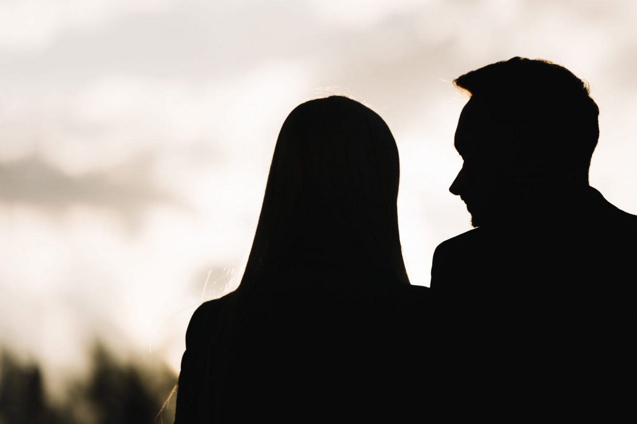 date-silhouette-fp Silhouettes of man and woman on date.