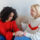Woman comforting a friend while discussing domestic abuse support