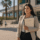 Woman leaving a courthouse with a trained protection specialist nearby, symbolizing safety and support for domestic violence survivors after leaving an abusive relationship.