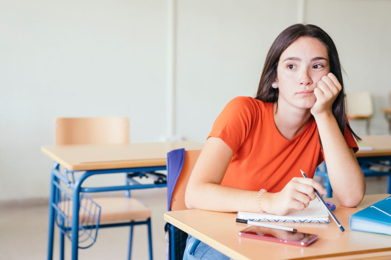 Teen experiencing domestic violence struggles with academic performance at school